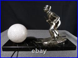 Sculpture statue lampe ancienne art déco régule skieur ski sport d'hivers globe
