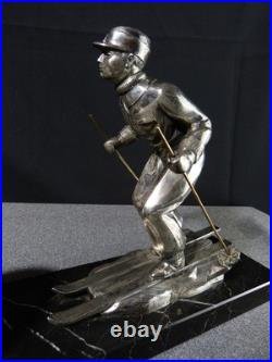 Sculpture statue lampe ancienne art déco régule skieur ski sport d'hivers globe