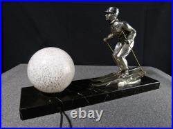 Sculpture statue lampe ancienne art déco régule skieur ski sport d'hivers globe
