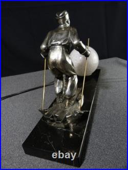 Sculpture statue lampe ancienne art déco régule skieur ski sport d'hivers globe