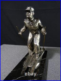 Sculpture statue lampe ancienne art déco régule skieur ski sport d'hivers globe