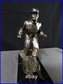 Sculpture statue lampe ancienne art déco régule skieur ski sport d'hivers globe