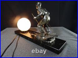 Sculpture statue lampe ancienne art déco régule skieur ski sport d'hivers globe